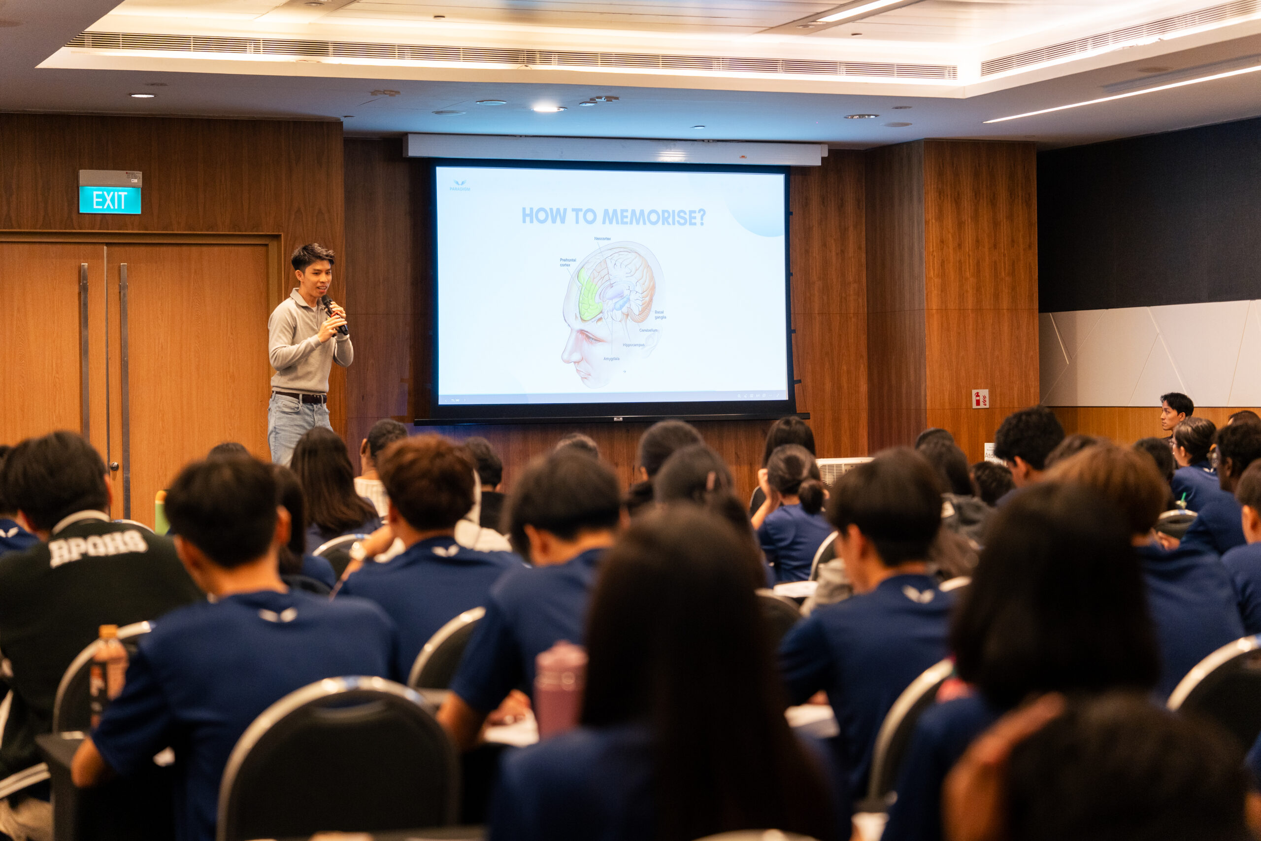 Paradigm teacher presenting advanced exam strategies to students